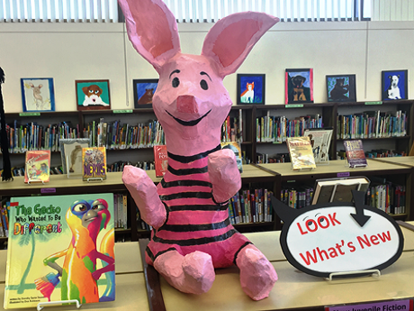 Piglet figure on library shelf