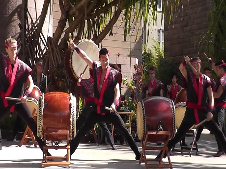 youths playing taiko drums outside