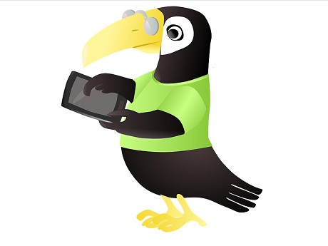 Bird wearing glasses and green shirt, reading electronic tablet.