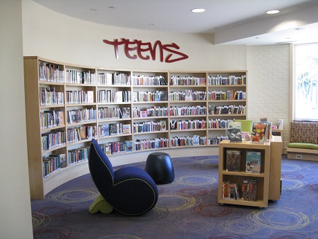 Teen area with chair and bookshelf