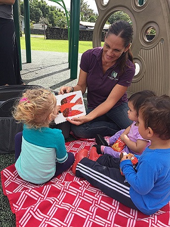 woman reading to children