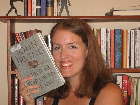 A woman reading "A Prayer for Owen Meany" by John Irving