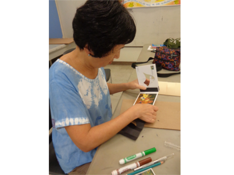 Picture of women creating a map book craft