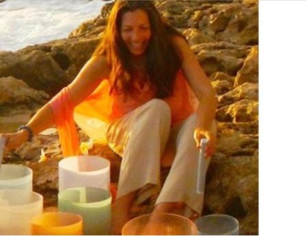 woman on the beach demonstrating signing bowls