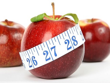 Apple with measuring tape