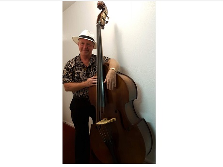 Man standing next to bass