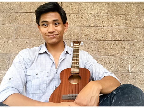 Joseph Almuena holding a ukulele