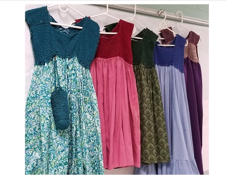Photo of 5 hanging knit and sew craft dresses