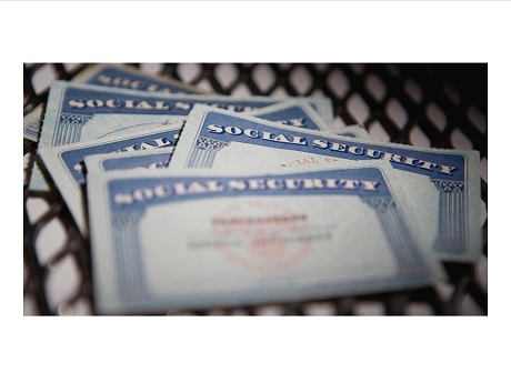 Color photo of 4 overlapping Social Security cards