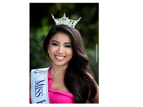 Penelope Ng wear pink, a MISS HAWAII slash and a crown