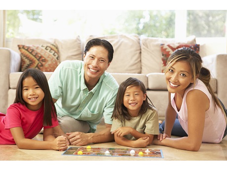 Family of four playing games