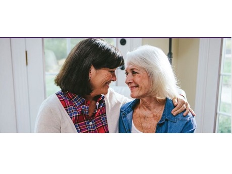 Young woman with her arm around an older woman