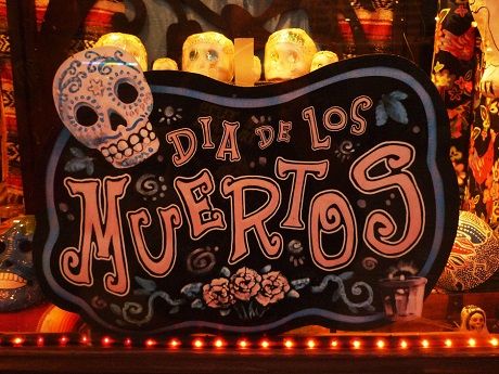 sign reads Dia de los Muertos