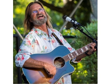 Uncle Wayne singing and playing the guitar