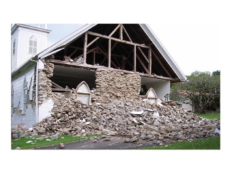 earthquake damage of a house where the front panel of the house has been torn off