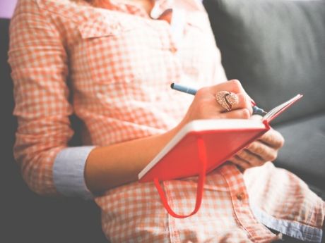 Woman writing in journal