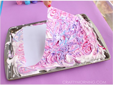 Pink, purple shaving cream with paper