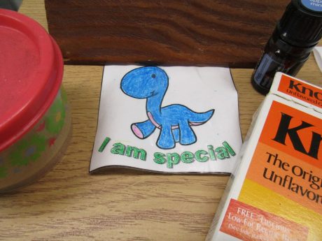 Dinosaur sticker with the words "I am special"