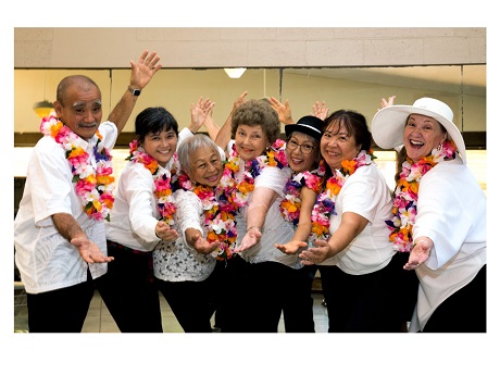 adults singing group posing with arms out