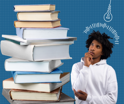 teen boy looks quizzically stack of book.