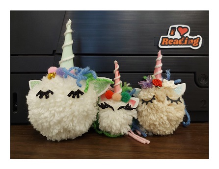 three pom pom unicorns