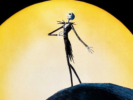 Jack Skellington in front of a yellow moon, singing.