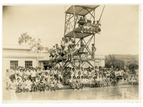 Women’s athletic teams at Palama Settlement take a group photo at the pool