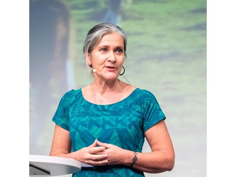 Woman presenting at podium