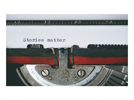 Image of typewriter with words "Stories Matter"