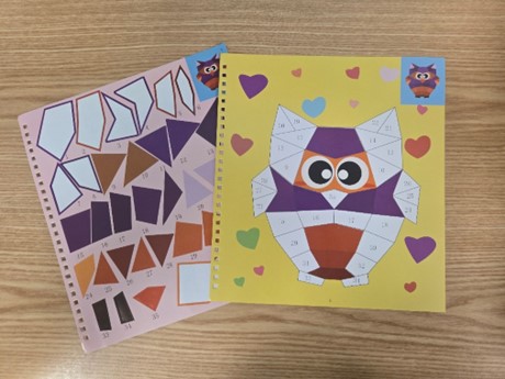 sticker and a paper with an owl with numbers