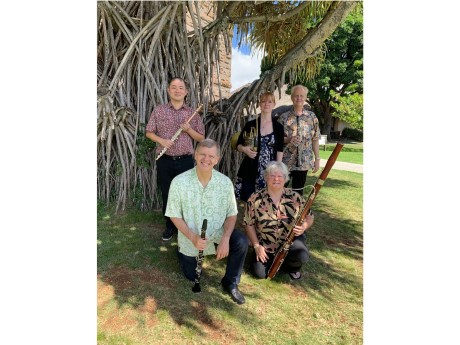 five wind musicians with instruments