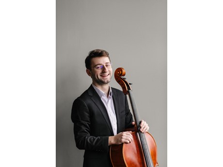 Man wearing glasses with cello.